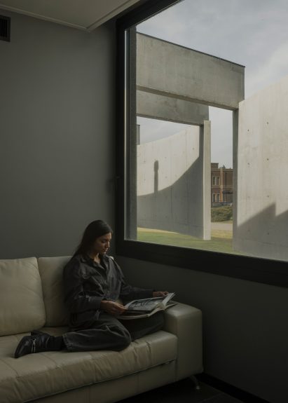Casa Alba by Ademas Arquitectura, a concrete house with a wall for privacy