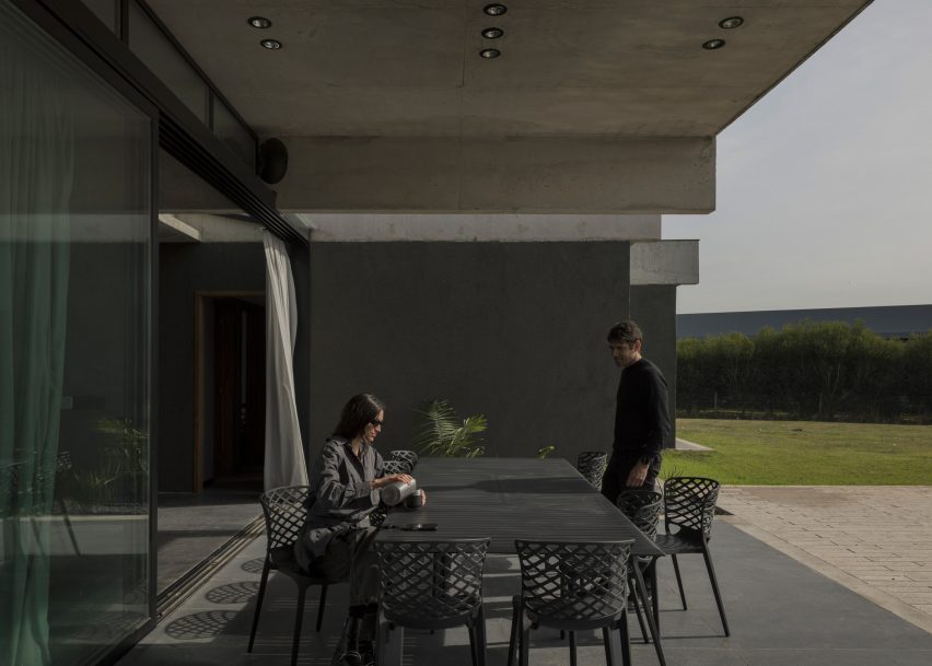 Casa Alba by Ademas Arquitectura, a concrete house with a wall for privacy