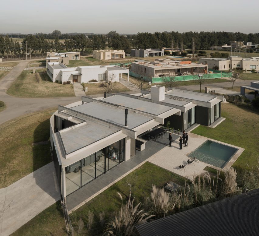 Casa Alba by Ademas Arquitectura, a concrete house with a wall for privacy