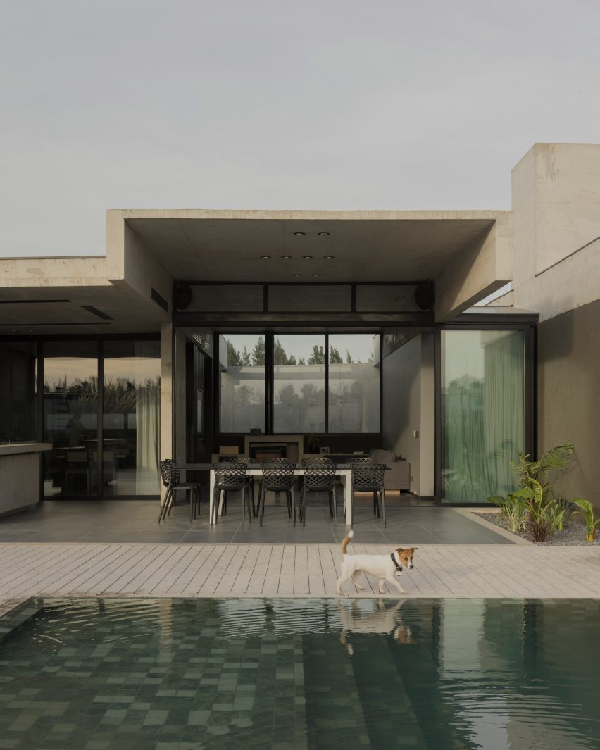 Casa Alba by Ademas Arquitectura, a concrete house with a wall for privacy