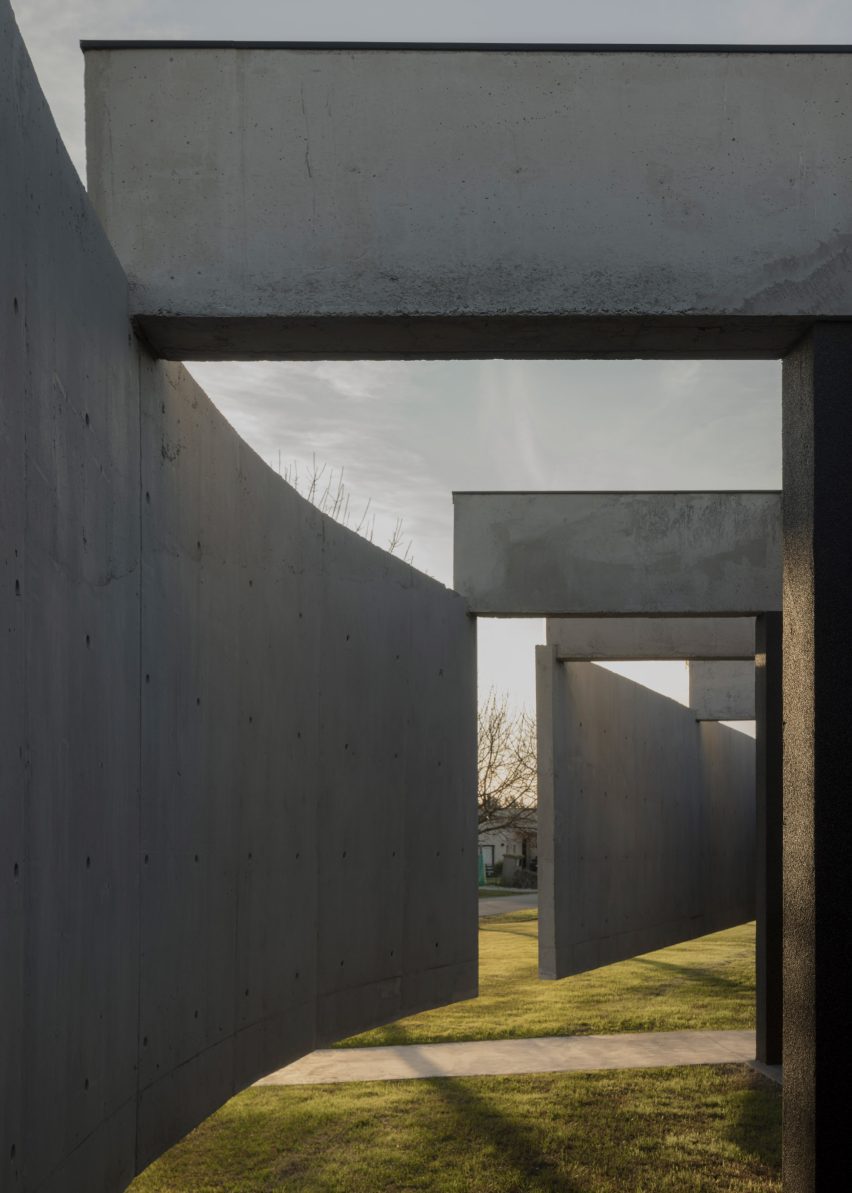 Casa Alba by Ademas Arquitectura, a concrete house with a wall for privacy