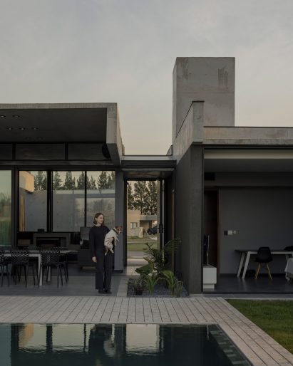 Casa Alba by Ademas Arquitectura, a concrete house with a wall for privacy