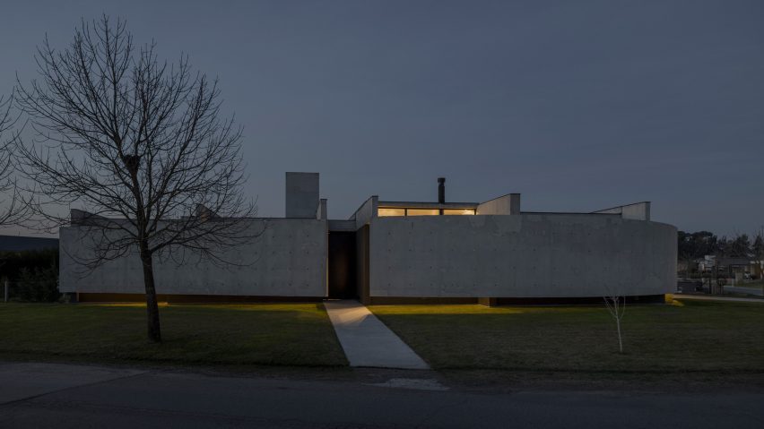 Casa Alba by Ademas Arquitectura, a concrete house with a wall for privacy