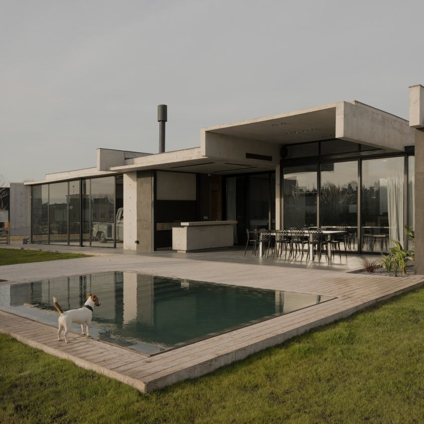 Casa Alba by Ademas Arquitectura, a concrete house with a wall for privacy