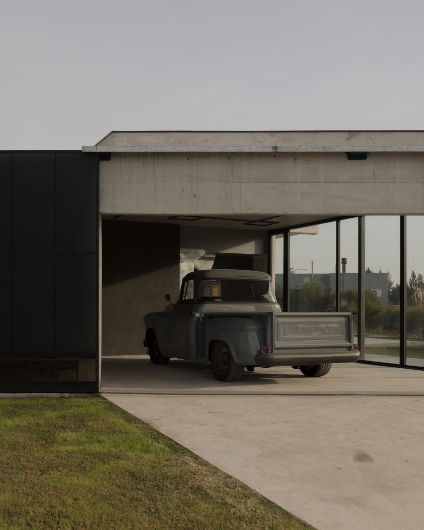 Casa Alba by Ademas Arquitectura, a concrete house with a wall for privacy