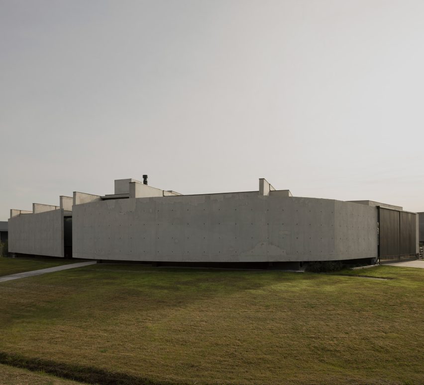 Casa Alba by Ademas Arquitectura, a concrete house with a wall for privacy