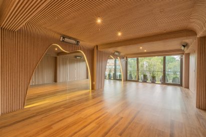 The exercise space at Align Studio is wrapped in oak slats