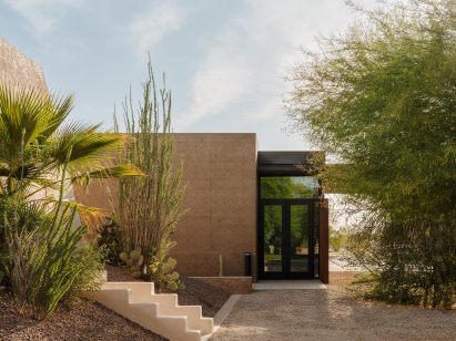 Building with pigmented cast-concrete walls that echo the hues of the surrounding landscape