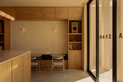 The front of a cafe including a bar area and further seating