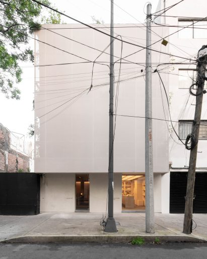 Lamartine hotel's upper level are concealed by a metal-mesh screen