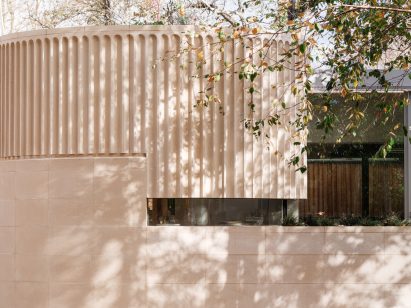 fluted concrete and stone facade