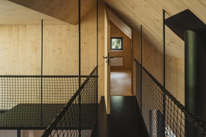 Spruce wood and black steel interior of cabin