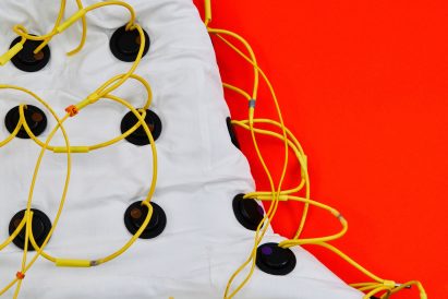 Coat covered in speakers and wires