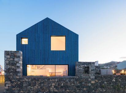 The Blue House Atelier Backlar lit up at night