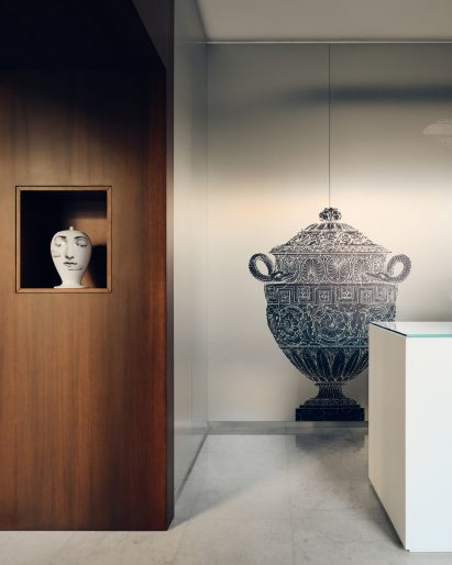 Fornasetti vase on wall