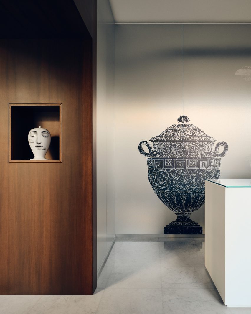 Fornasetti vase on wall