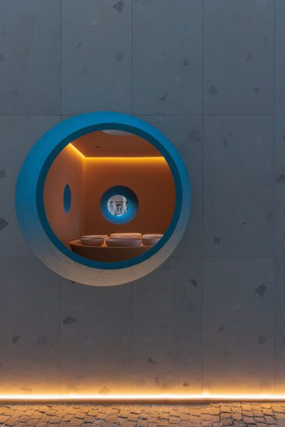 View of interior of structure seen through a round window