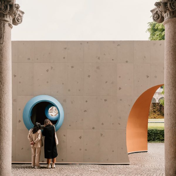 Exterior of tile-clad structure with round blue windows
