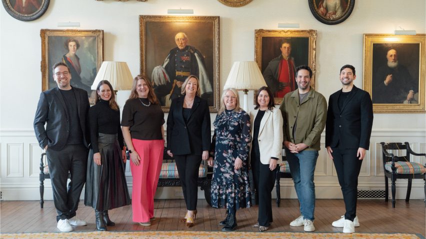 Photo of people in front of paintings