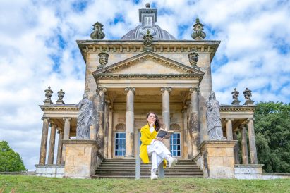 Photo of Es Devlin outside of the Temple of the Four Winds in Castle Howard
