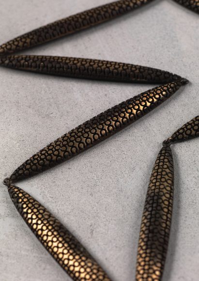 Metal jewellery with fine circular details