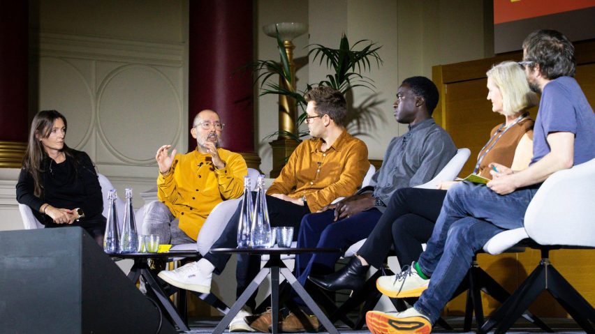 Photo of people talking on a stage