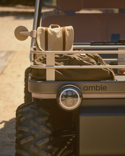 Photo of bags stored in the tubular metal front basket of the Amble One buggy