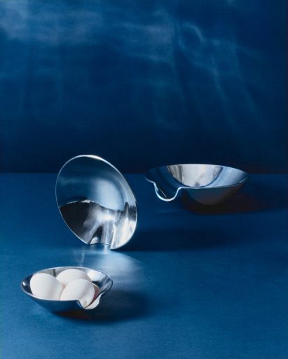 Metal bowls with eggs in them