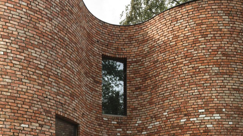 Curved brick house