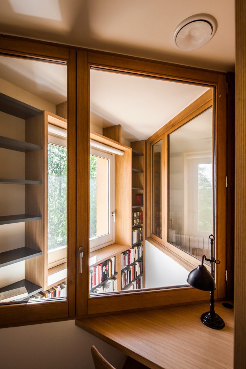 View through internal glazing overlooking the double-height library space