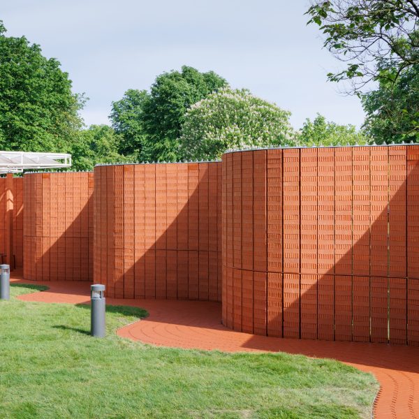 Curving red-brick walls