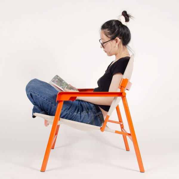 image of a person sitting in a orange and beige chair