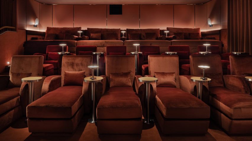 Screening room with red velvet chairs