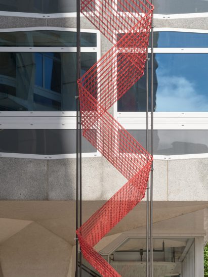 Red metal tower outside Space House in London