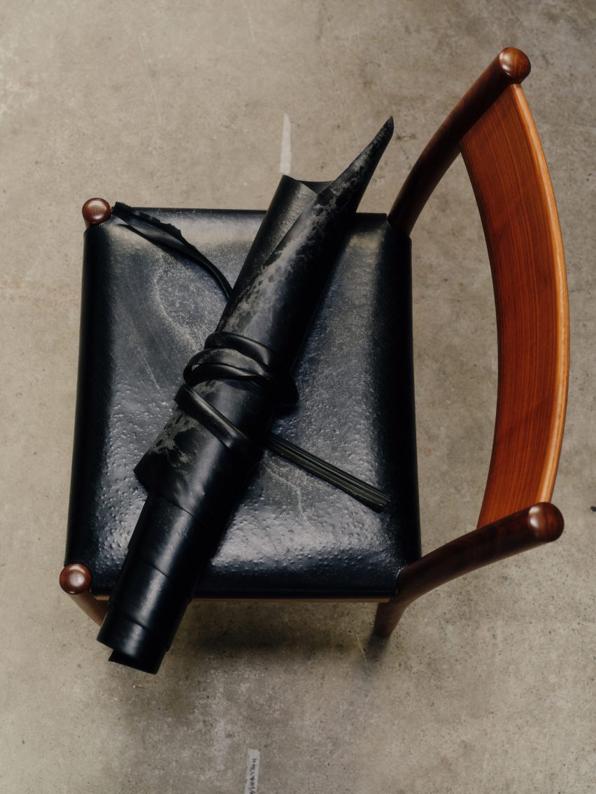 Photo of the Made by Morgen seating upholstered in Other Matter Leather with a roll of the material placed on top