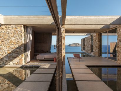 Stone-clad guest suites arranged around shallow reflecting pools