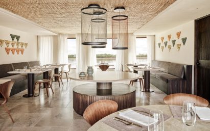 A bright lower-deck dining room decorated with tiles based on the scales on a giant Amazonian fish