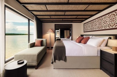 A guest suite with a panoramic window for watching the changing landscape