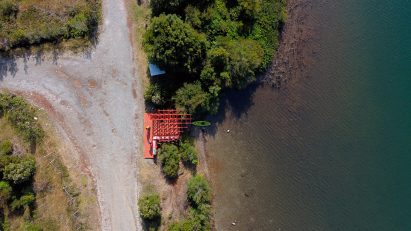 Red lakeside pavilion in Chile