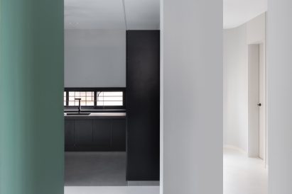 The monotone kitchen contrasts the rest of house in Villa Corsica by Neel Buddhadev