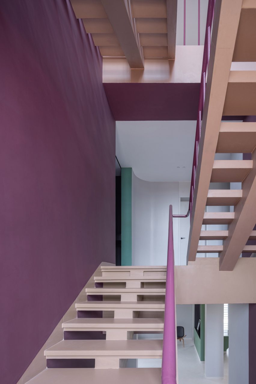 Bordeaus stairs lead to the upper levels in Villa Corsica