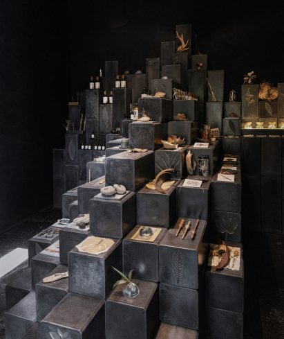 Ephemera linked to a perfume brand is displayed on steps