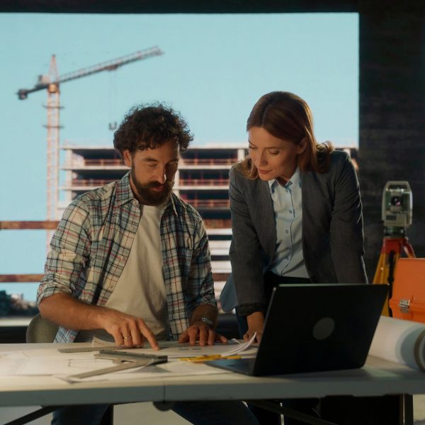 Photo of people planning architecture projects