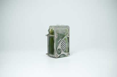 Photo of the back of the University of Cambridge's algae biocell showing a perforated transparent rectangular case filled with green goo