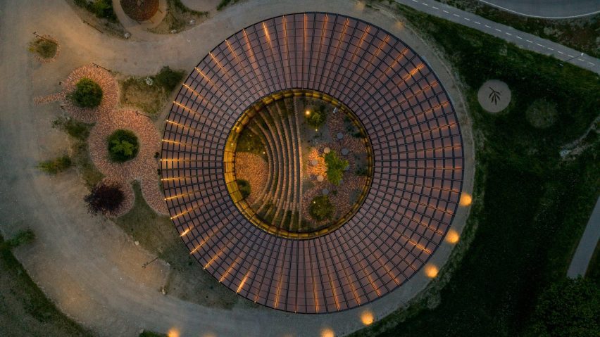 BIG arranges circular Dymak HQ around stepped courtyard