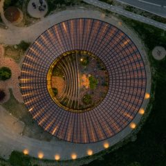 BIG arranges circular Dymak HQ around stepped courtyard