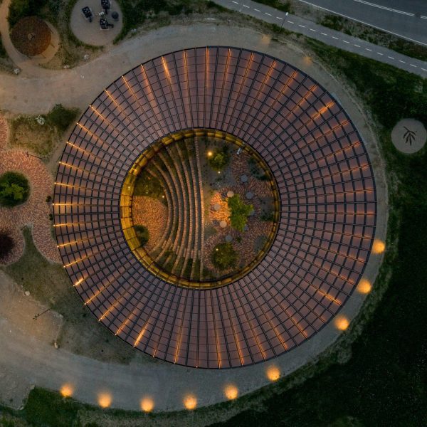 BIG arranges circular Dymak HQ around stepped courtyard