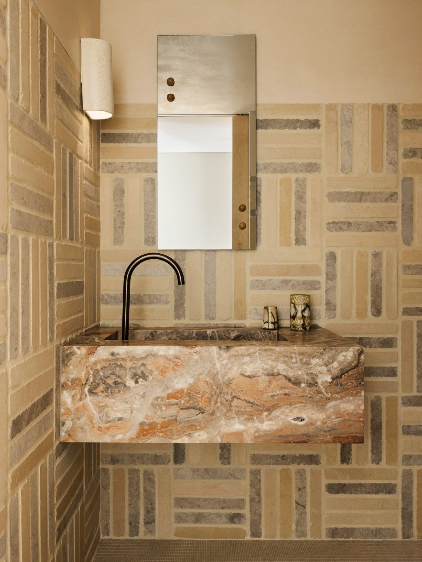 Marbled bathroom in Cinderella House by YSG Studio in Redfern Sydney
