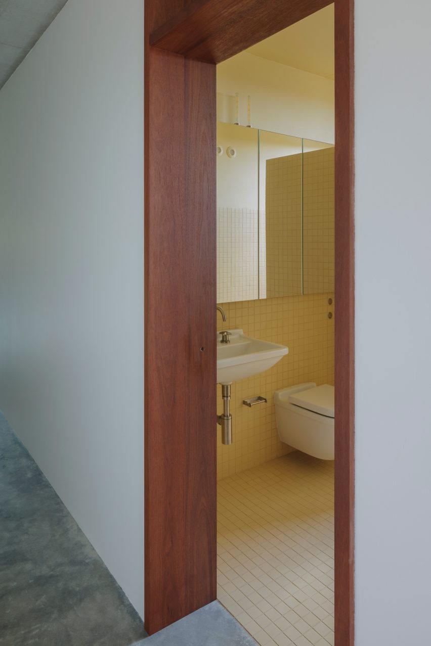 EA House by Bokey Grant yellow bathroom