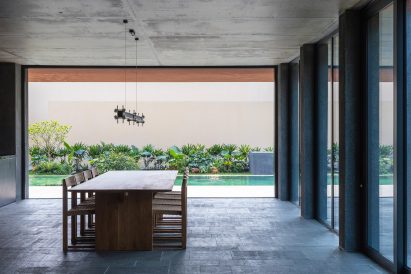 Dining room and pool at a multi-generational home in Vietnam
